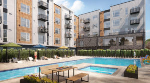 Lynnwood Apartments-Alexan Access- Sparkling Pool with Sun Lounge Chairs and Additional Seating Area